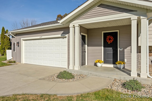 entrance to property featuring a garage