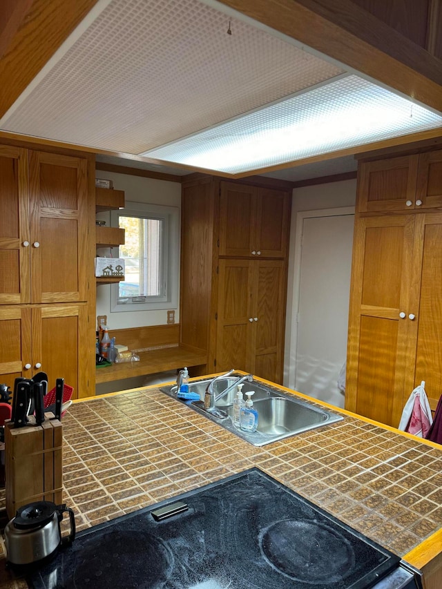 kitchen with tile countertops and sink