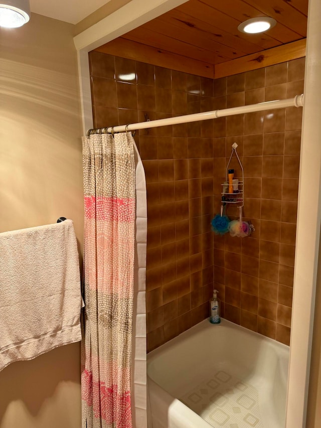 bathroom featuring shower / bath combination with curtain