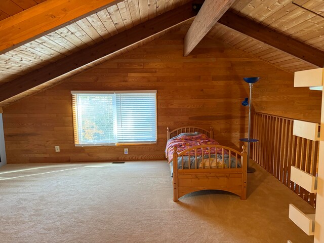 carpeted bedroom with vaulted ceiling with beams, wood ceiling, and wooden walls