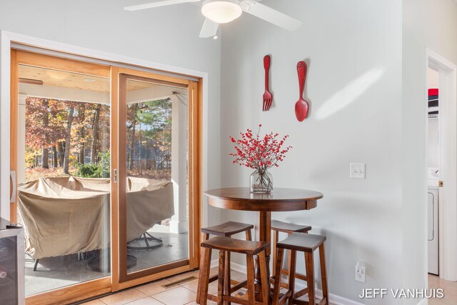 tiled dining area featuring ceiling fan