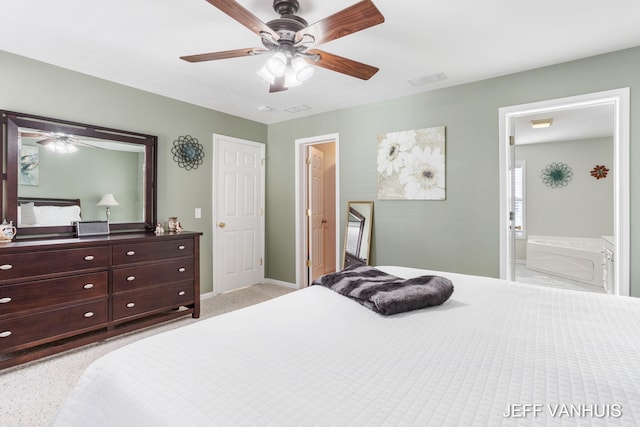 bedroom with ensuite bathroom and ceiling fan