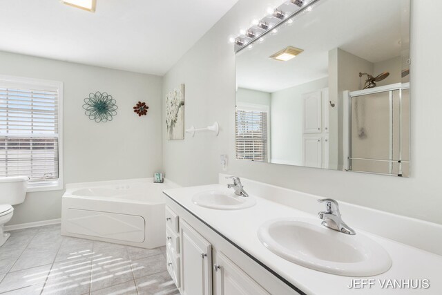 full bathroom with toilet, plus walk in shower, vanity, and tile patterned flooring