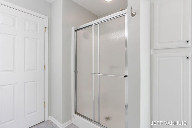 bathroom featuring an enclosed shower