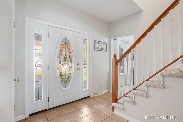 foyer featuring light tile patterned floors