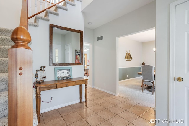 hallway with tile patterned flooring