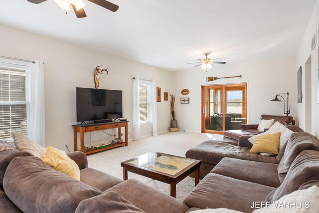 living room featuring ceiling fan and carpet floors