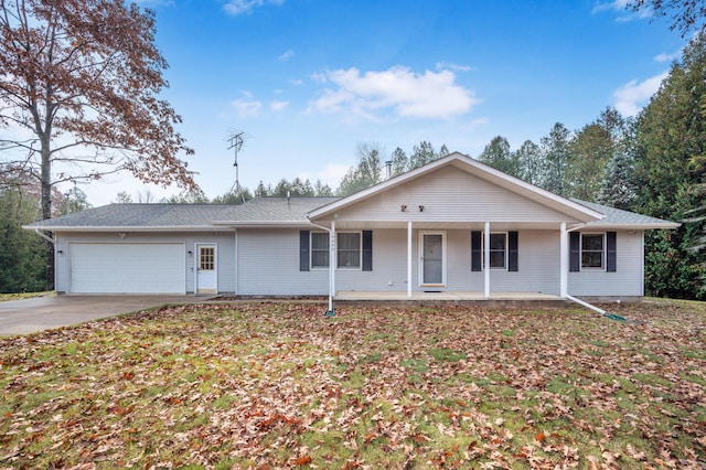 single story home featuring a porch and a garage