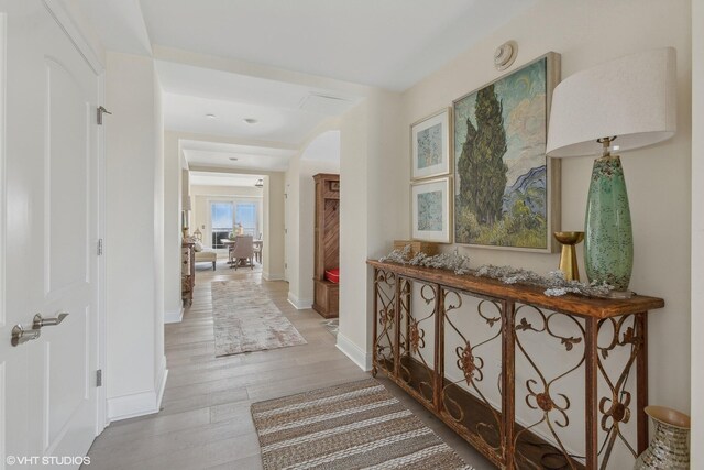 hall with light wood-type flooring