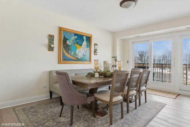 dining room with hardwood / wood-style floors