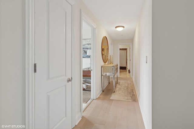 hall with light hardwood / wood-style floors