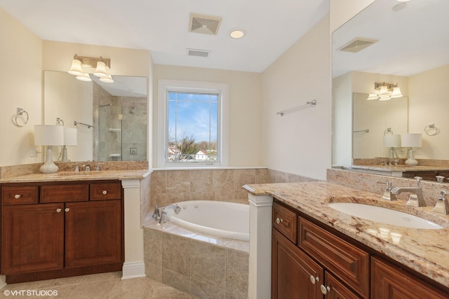 bathroom featuring separate shower and tub, tile patterned flooring, and vanity