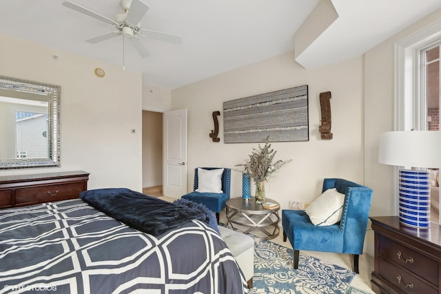 bedroom featuring ceiling fan and multiple windows