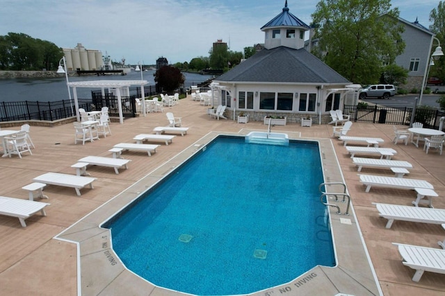 view of swimming pool featuring a patio area