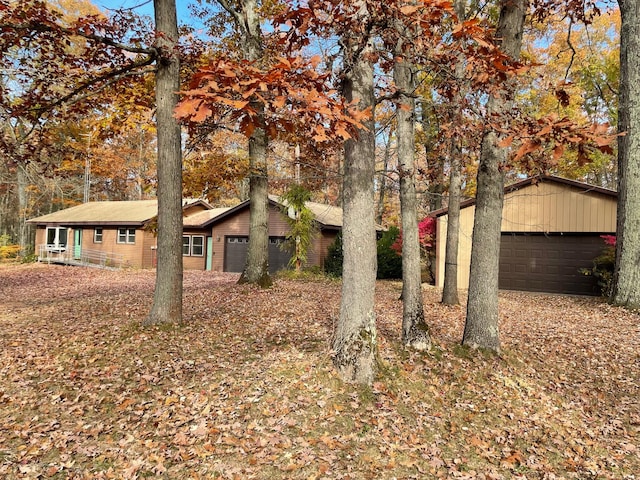 view of home's exterior featuring an outbuilding and a garage