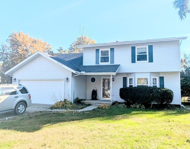 front facade featuring a front lawn and a garage