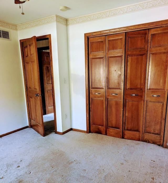 unfurnished bedroom featuring light colored carpet