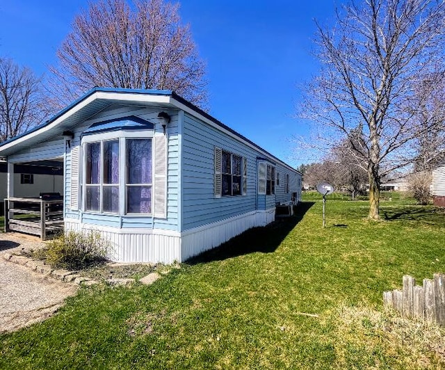 view of side of property featuring a yard