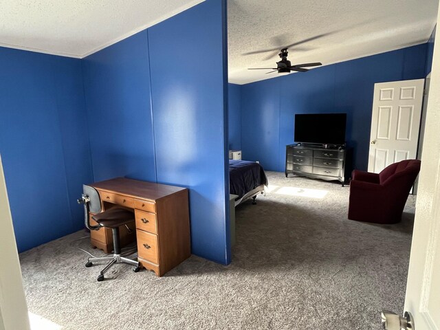 office area with a textured ceiling, carpet flooring, and ceiling fan