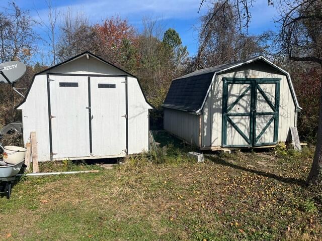 view of outbuilding featuring a yard