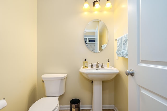 bathroom featuring sink and toilet