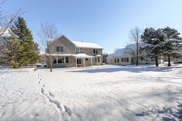 view of snow covered house