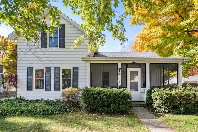 view of front of house featuring a sunroom