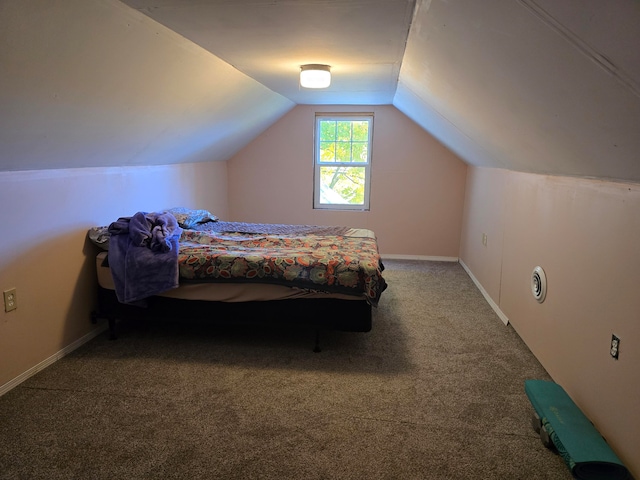 carpeted bedroom featuring lofted ceiling