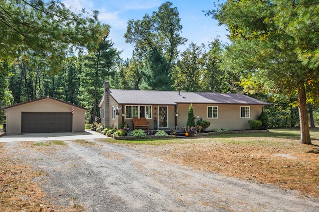 ranch-style house featuring an outbuilding and a garage