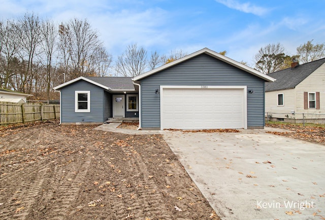 ranch-style home featuring a garage