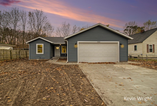 ranch-style home featuring a garage