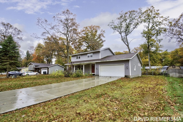 front of property with a garage and a front lawn