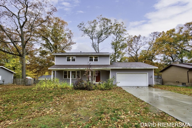 view of property featuring a front lawn, covered porch, and a garage