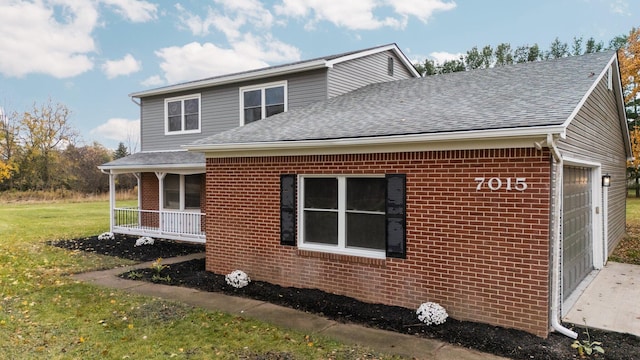 view of side of home with a lawn