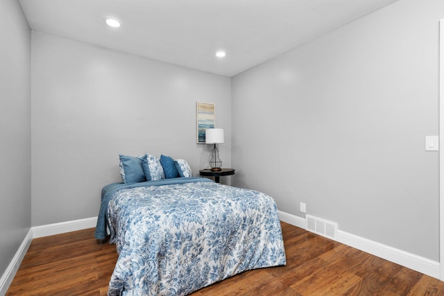 bedroom featuring dark hardwood / wood-style flooring