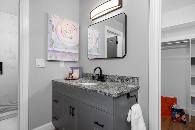 bathroom featuring vanity and hardwood / wood-style floors