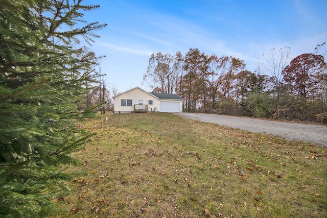 view of front of house with a front yard and a garage