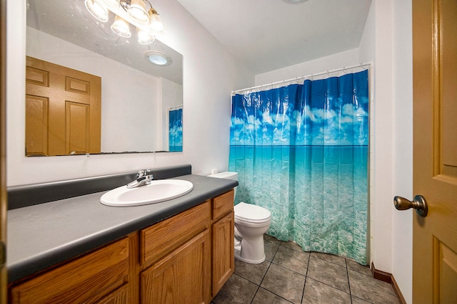 bathroom featuring vanity, toilet, and tile patterned floors