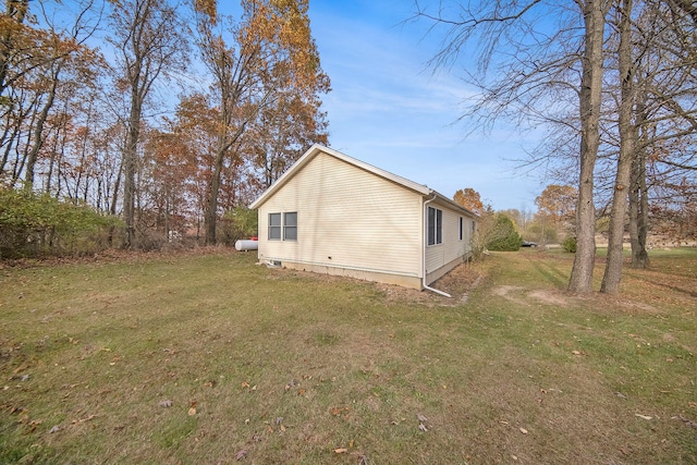 view of home's exterior with a lawn