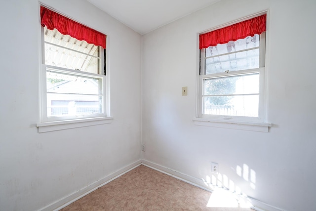 spare room with a healthy amount of sunlight