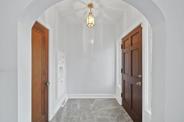 view of carpeted entrance foyer