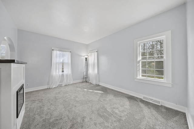 unfurnished living room with carpet floors