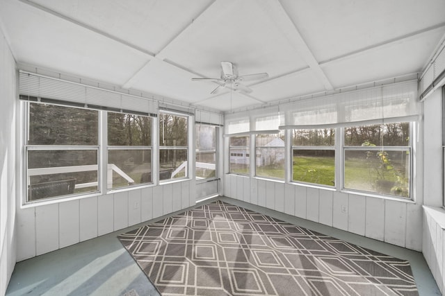 unfurnished sunroom with ceiling fan