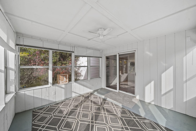 unfurnished sunroom featuring ceiling fan