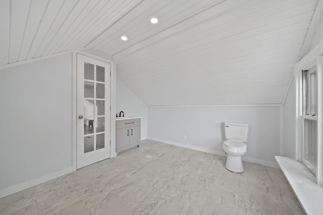 additional living space featuring wood ceiling, sink, and vaulted ceiling