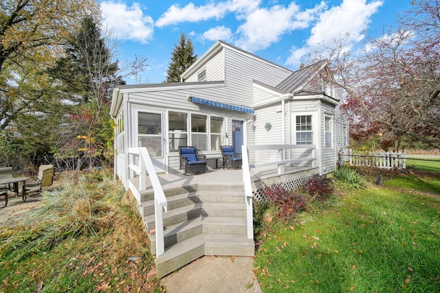 back of property featuring a deck