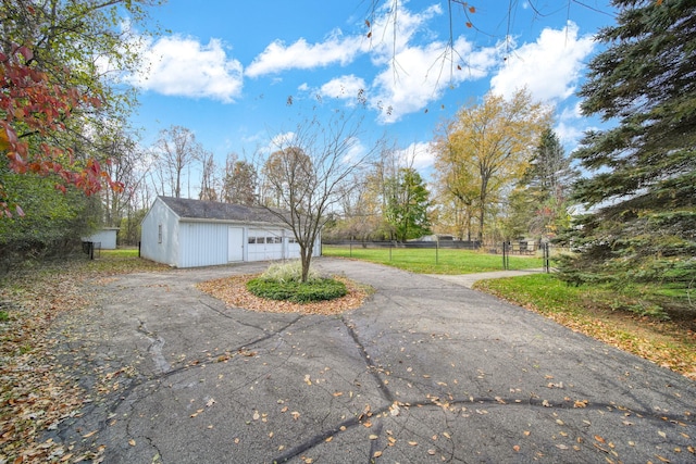 view of side of property with an outbuilding and a garage