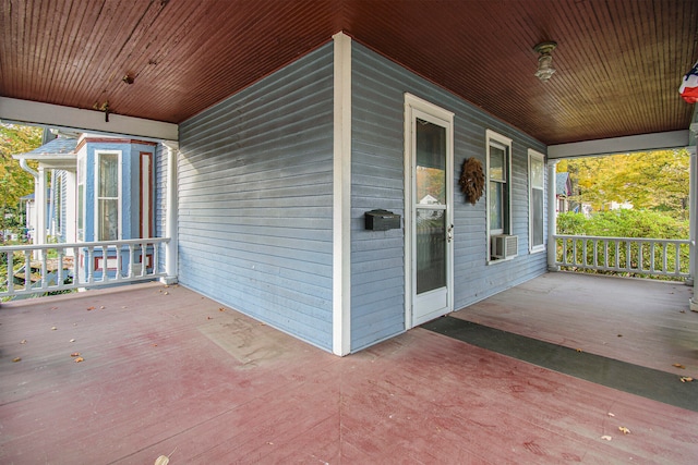 view of patio with cooling unit and covered porch