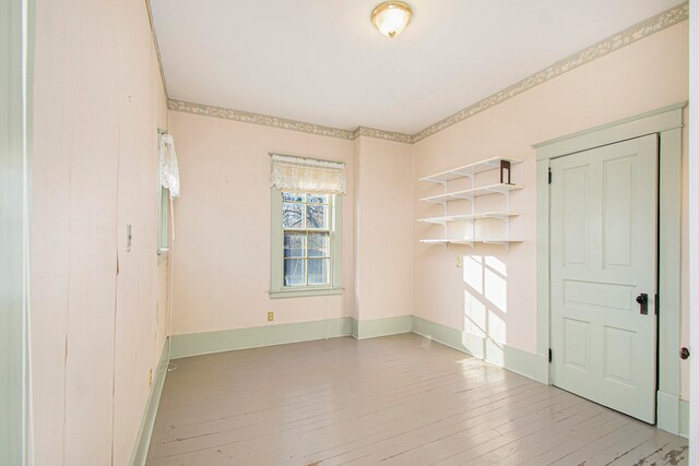 unfurnished room with light hardwood / wood-style floors