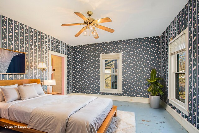 bedroom with hardwood / wood-style floors and ceiling fan